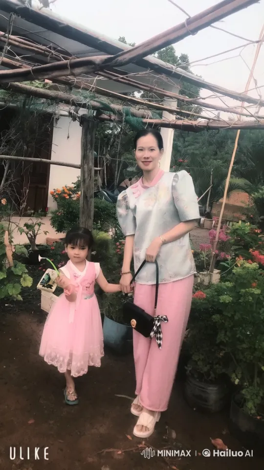 Woman and Girl Enjoy Peaceful Moment in Countryside Garden – AI Generated Video | Hailuo AI