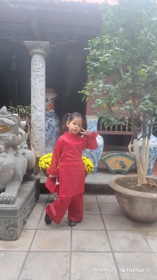 Child in Red Outfit Poses at Peaceful Temple – AI Generated Video | Hailuo AI