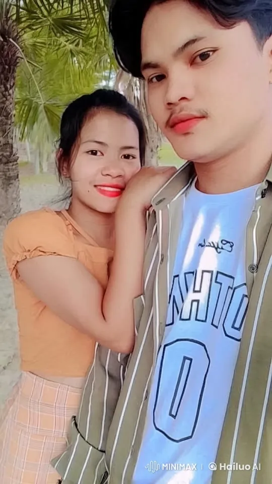 Young Couple Relaxing Under a Palm Tree – AI Generated Video | Hailuo AI