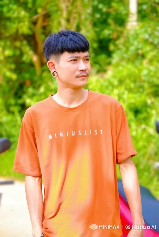Young Man in 'MINIMALIST' T-Shirt Enjoying Nature – AI Generated Video | Hailuo AI