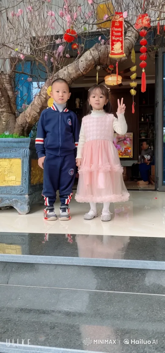 Siblings Perform Playful Kungfu Under Festive Tree – AI Generated Video | Hailuo AI