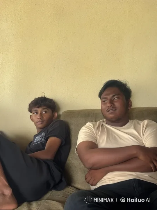 Two Young Men Relaxing on Couch in Calm Setting – AI Generated Video | Hailuo AI