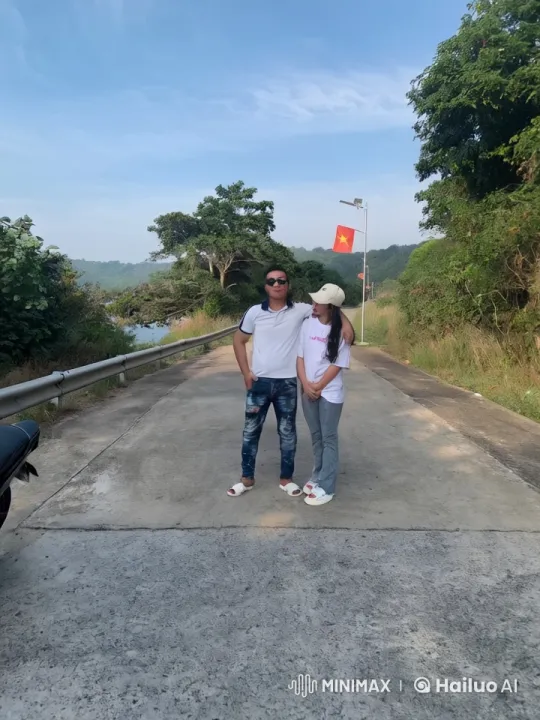 Couple's Synchronized Kungfu on Tranquil Road – AI Generated Video | Hailuo AI