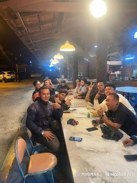Friends Enjoying Outdoor Meal Under Warm Lights – AI Generated Video | Hailuo AI