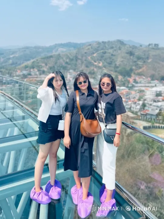 Women Perform Kung Fu on Glass Bridge Amidst Scenic Backdrop – AI Generated Video | Hailuo AI