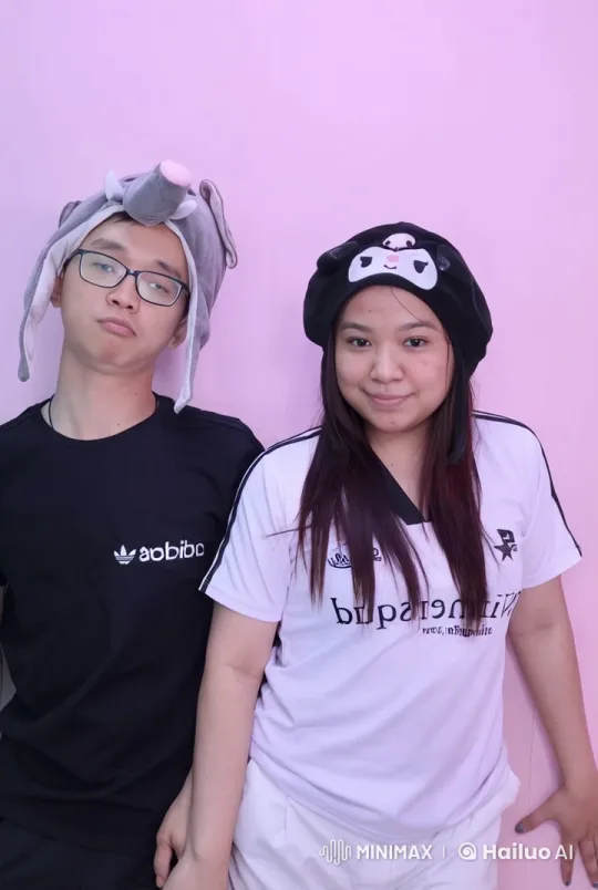 Two Individuals in Fun Skirmish with Playful Hats – AI Generated Video | Hailuo AI