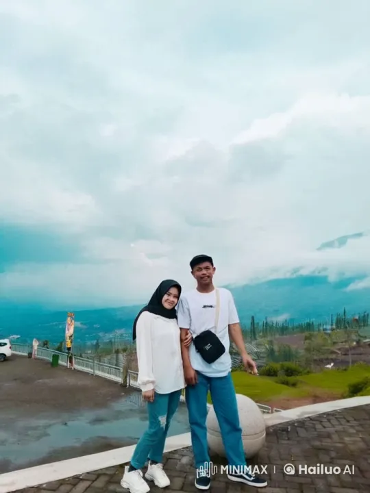 Young Couple Engages in Playful Kung Fu Fight Against Mountain Backdrop – AI Generated Video | Hailuo AI
