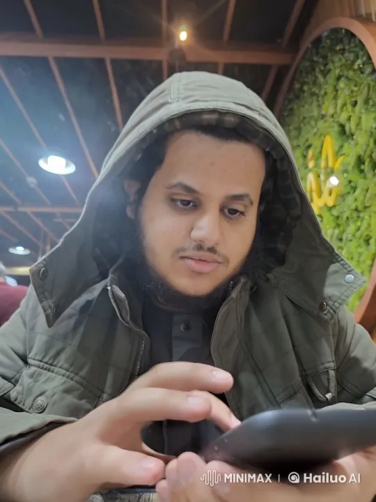 Mysterious Hooded Figure in Cozy Café – AI Generated Video | Hailuo AI
