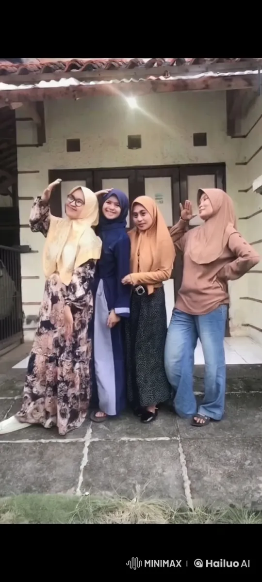 Four Women in Hijabs Pose Playfully in Front of a Building – AI Generated Video | Hailuo AI