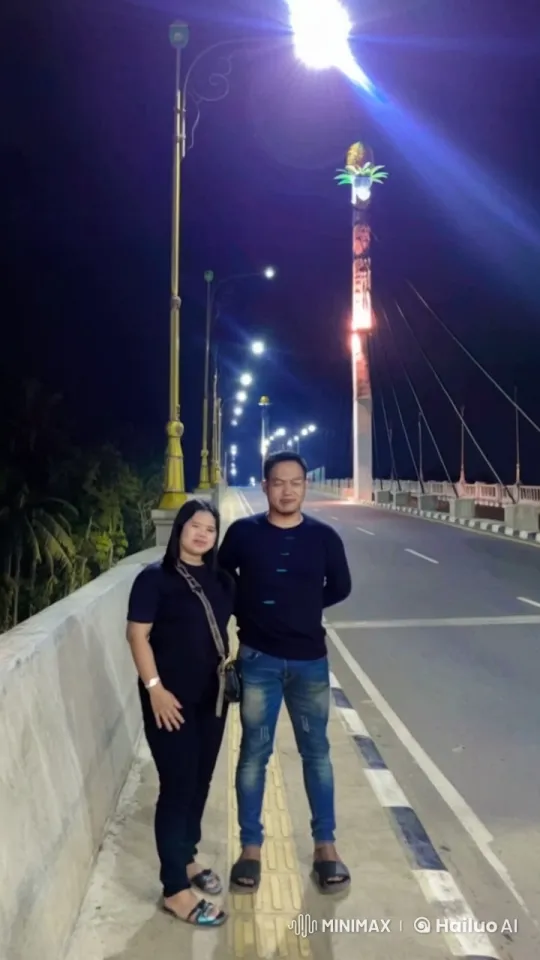 Couple Performs Synchronized Kungfu on Lit Bridge – AI Generated Video | Hailuo AI