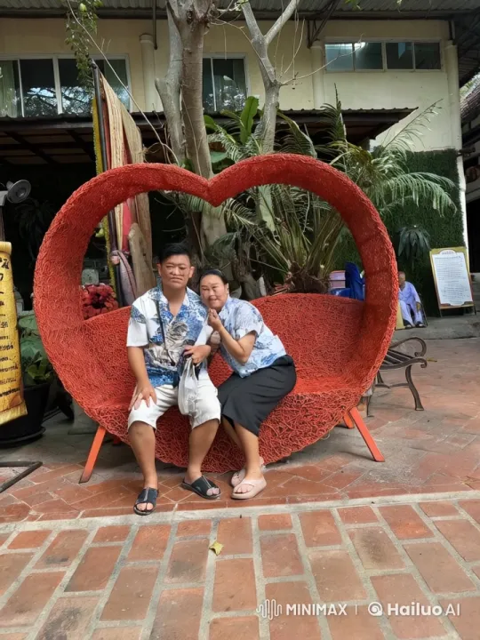 Hawaiian Shirted Duo Perform Kung Fu on Heart-Shaped Bench – AI Generated Video | Hailuo AI