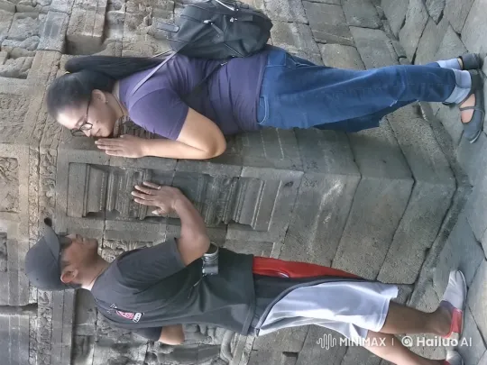 Couple Cautiously Analyzes Ancient Stone Carvings – AI Generated Video | Hailuo AI