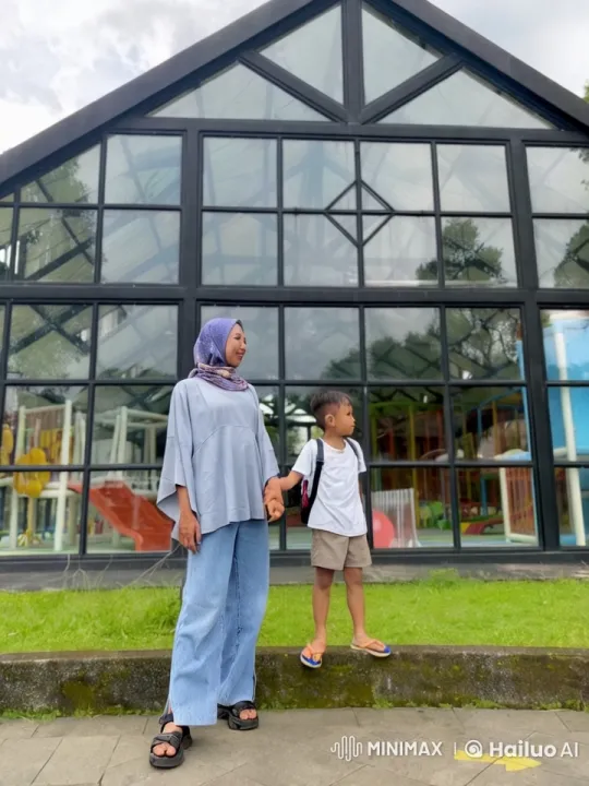 Boy in Martial Arts Pose in Front of Greenhouse Playground – AI Generated Video | Hailuo AI
