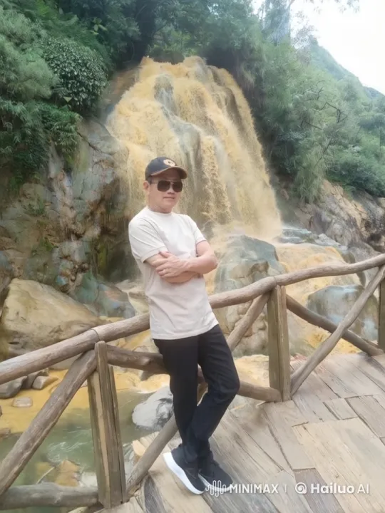 Kung Fu Master Practices at Tranquil Waterfall Bridge – AI Generated Video | Hailuo AI