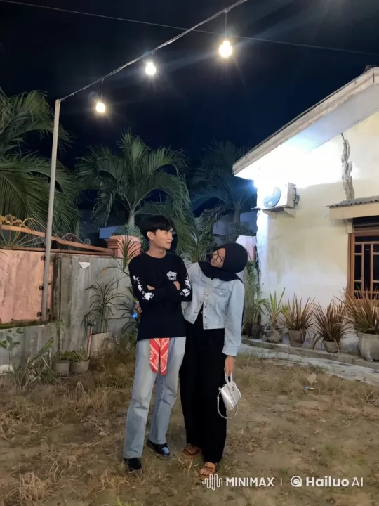 Couple in Dimly Lit Garden with Hanging Lights – AI Generated Video | Hailuo AI