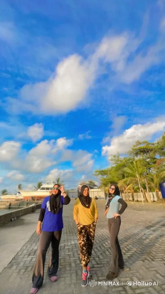 Three Women Enjoy Playful Moment on Seaside Walkway – AI Generated Video | Hailuo AI