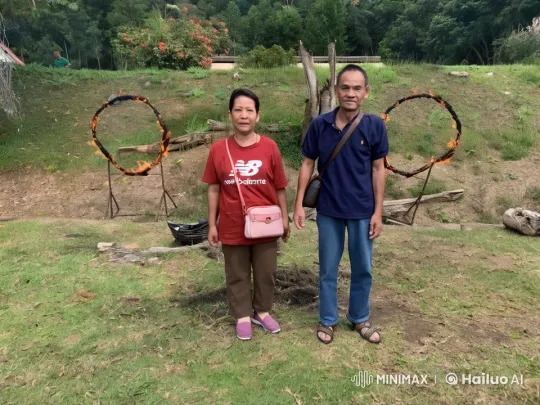 Two Individuals in Serene Outdoor Setting with Flame Structures – AI Generated Video | Hailuo AI