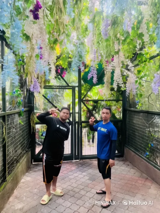Martial Arts Display Amidst Colorful Hanging Flowers – AI Generated Video | Hailuo AI