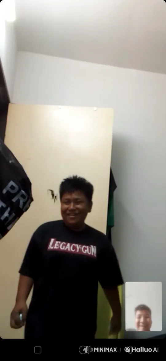 Person Demonstrates Kung Fu in Narrow Room with Legacy Gun Shirt – AI Generated Video | Hailuo AI