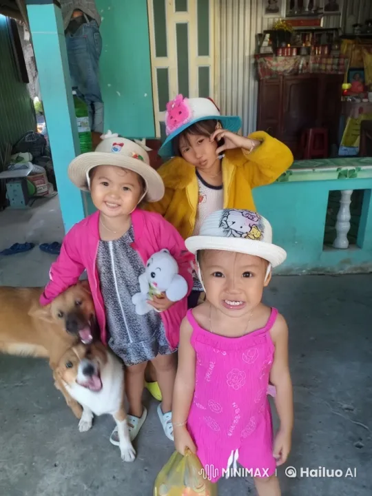 Joyful Children and Playful Dogs Pose Outside Colorful House – AI Generated Video | Hailuo AI