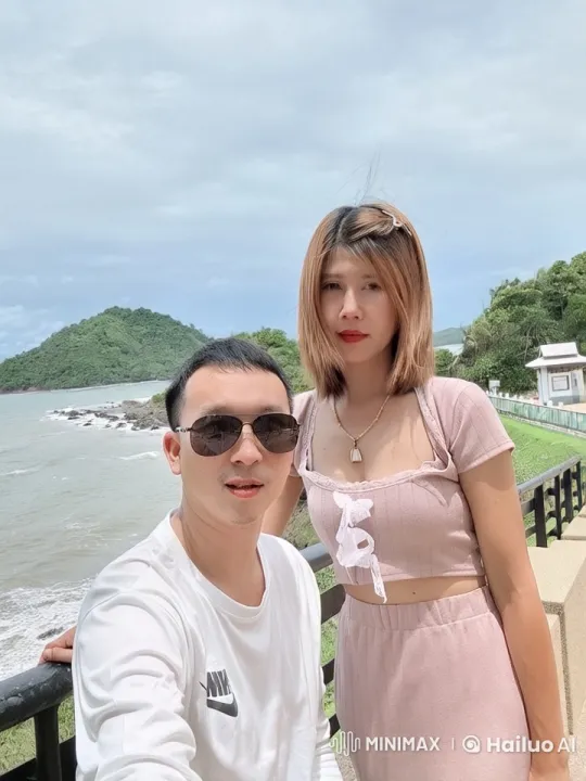 Couple Enjoying Seaside View on Wooden Rail – AI Generated Video | Hailuo AI