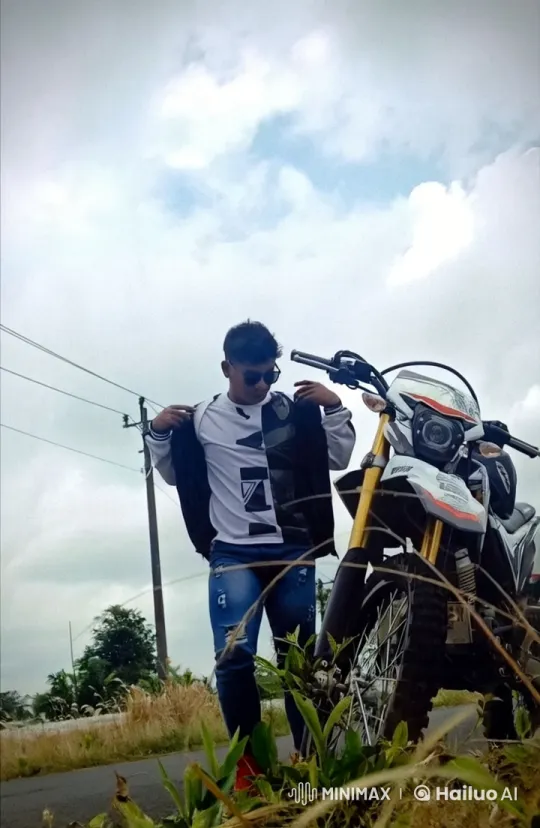 Young Man Showcases Kung Fu Skills Next to Dirt Bike – AI Generated Video | Hailuo AI