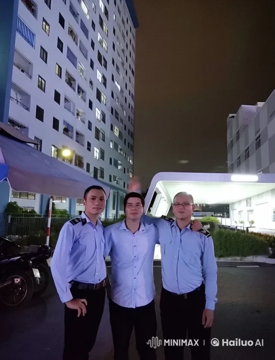 Three Men Pose in Front of Lit Building – AI Generated Video | Hailuo AI