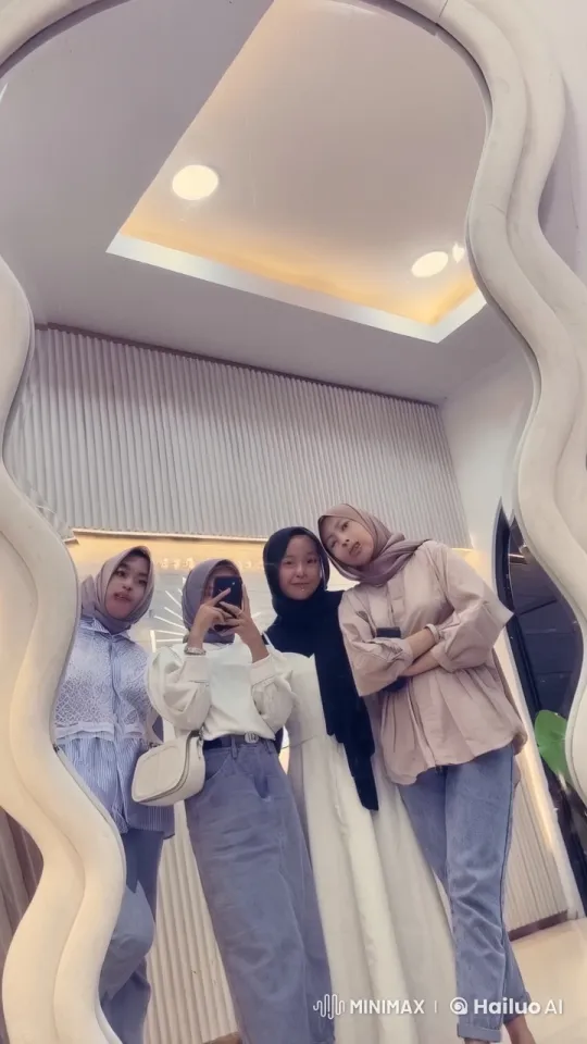 Four Stylish Friends Capture a Group Selfie in a Modern Setting – AI Generated Video | Hailuo AI