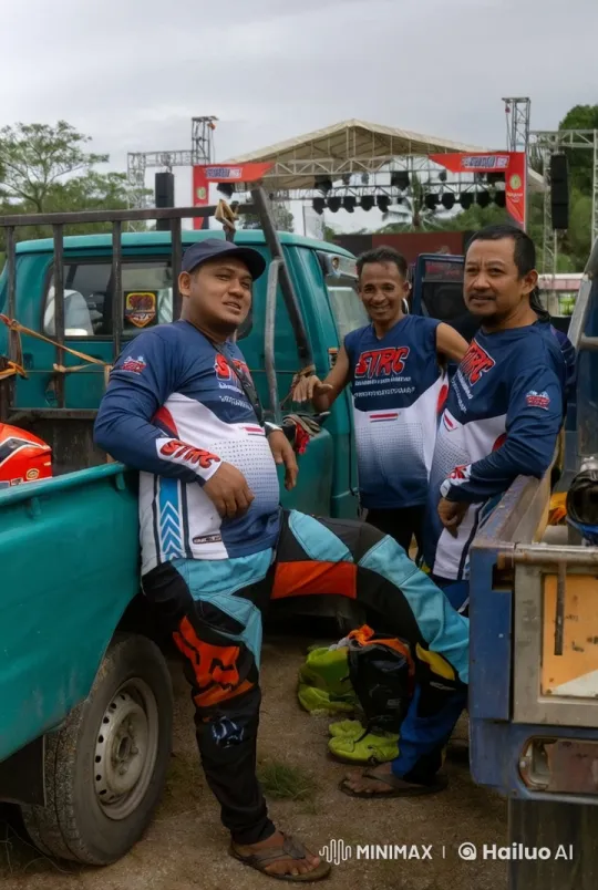 Three Men in STRC Jerseys by Trucks at Outdoor Event – AI Generated Video | Hailuo AI