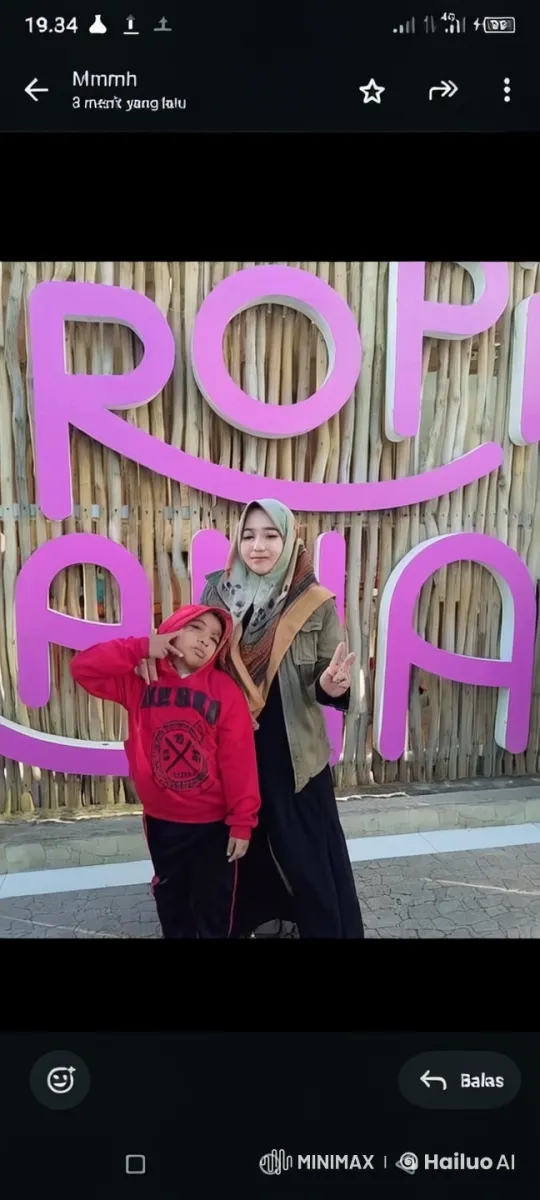 Mother and Son Perform Energetic Kung Fu in Front of Colorful Fence – AI Generated Video | Hailuo AI