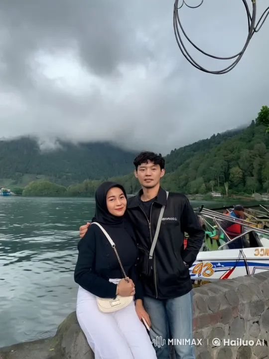 Couple Dances Playfully by Lake with Mountainous Background – AI Generated Video | Hailuo AI