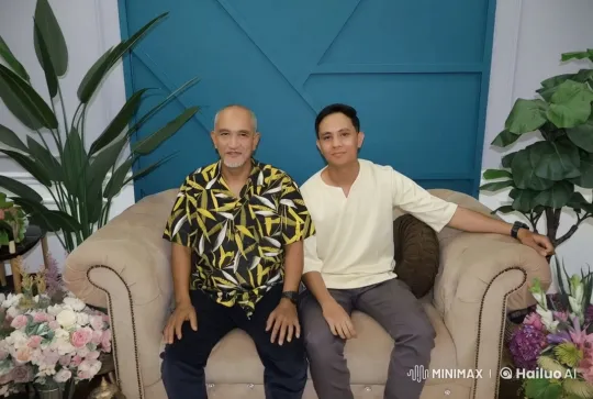 Two Men Relax on a Sofa in a Bright Room – AI Generated Video | Hailuo AI
