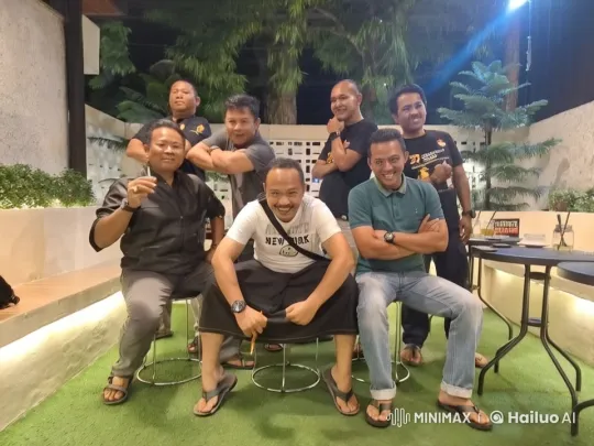 Seven Men Pose Confidently in Cozy Patio Setting – AI Generated Video | Hailuo AI