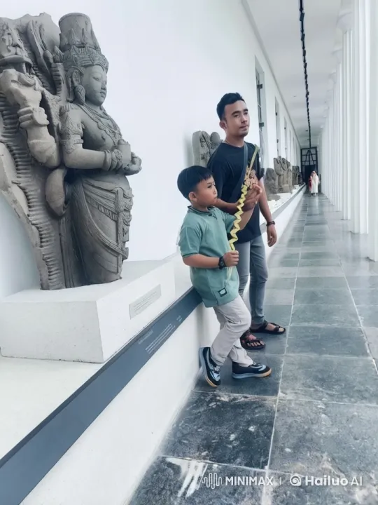 Child Demonstrates Kungfu Skills in Ancient Statue Gallery – AI Generated Video | Hailuo AI