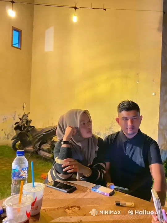 Cozy Evening: Two Friends Enjoy Drinks by a Warm Wall – AI Generated Video | Hailuo AI