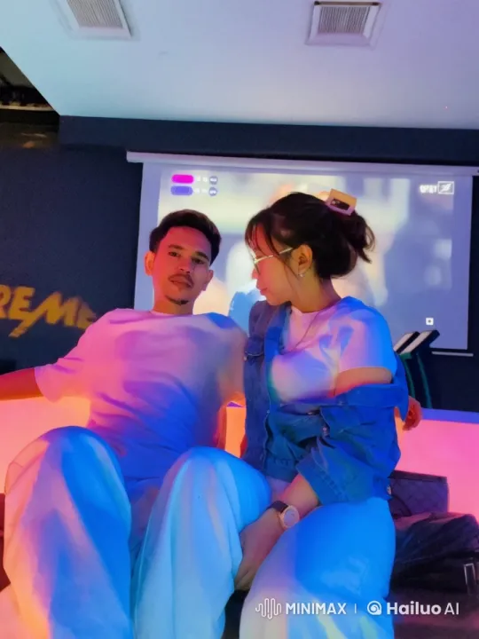 Couple's Playful Moment with Projector Background – AI Generated Video | Hailuo AI