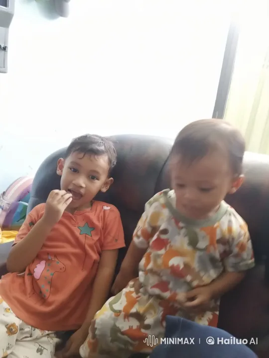 Two Children Practicing Playful Kungfu on Couch – AI Generated Video | Hailuo AI