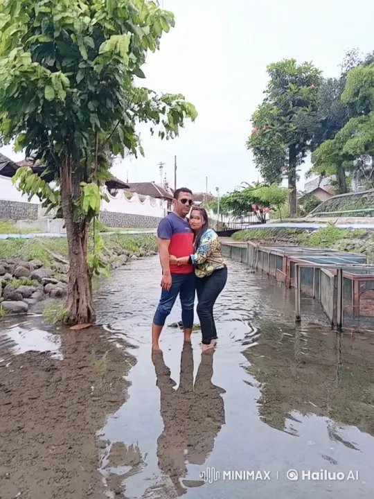 Couple Embracing in Reflective Water Amidst Serene Nature – AI Generated Video | Hailuo AI