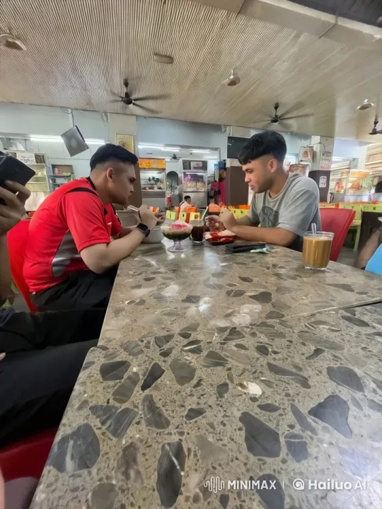 Casual Discussion Over Food in a Bustling Eatery – AI Generated Video | Hailuo AI