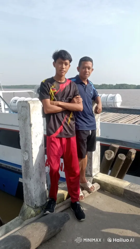 Two Individuals Relaxing by a River on a Dock – AI Generated Video | Hailuo AI