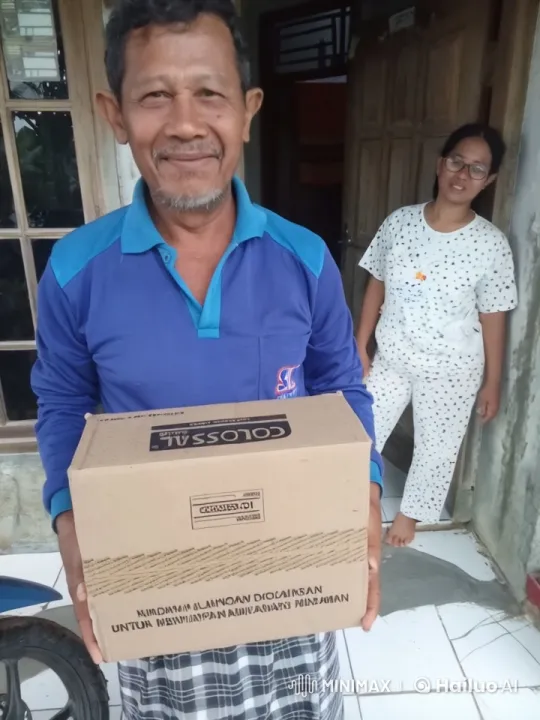 Man with 'COLOSSAL' Box in Front of Open House Door – AI Generated Video | Hailuo AI