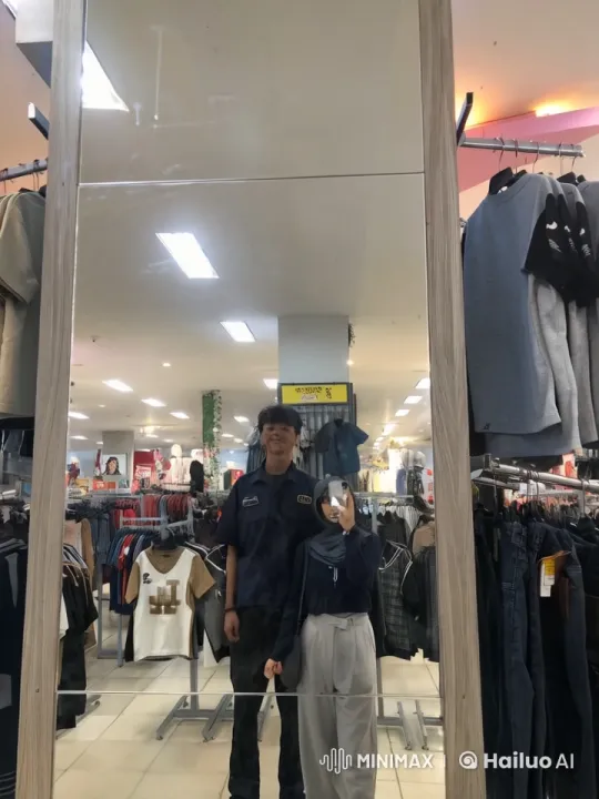Couple Practicing Kungfu in Clothing Store Mirror – AI Generated Video | Hailuo AI