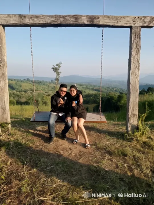 Couples Relaxing on Swing in Serene Countryside – AI Generated Video | Hailuo AI