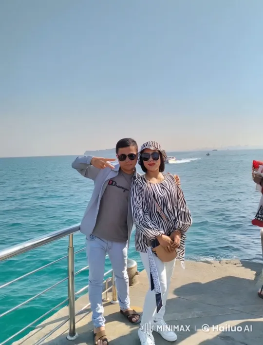 Young Couple Enjoying Peaceful Seaside Day – AI Generated Video | Hailuo AI