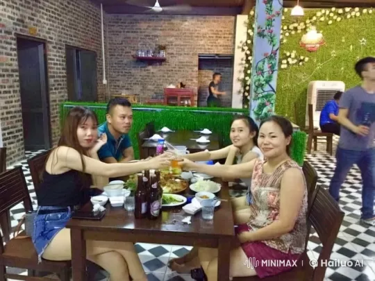 Friends Celebrate Joyful Meal in Cozy Restaurant Setting – AI Generated Video | Hailuo AI