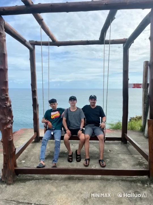 Friends Relax on Swing with Ocean View – AI Generated Video | Hailuo AI
