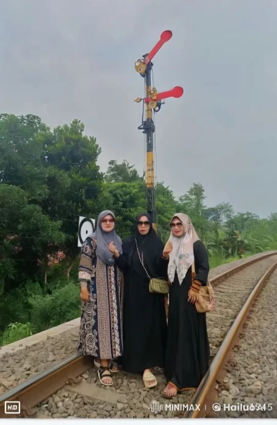 Women Pose on Railway Track Amid Nature – AI Generated Video | Hailuo AI