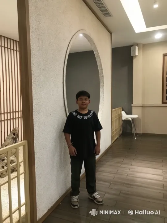 Young Kung Fu Practitioner Demonstrates Skill in Elegant Corridor – AI Generated Video | Hailuo AI