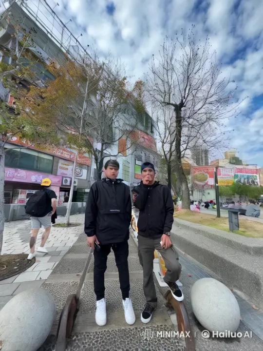 Friends Practice Kung Fu on Bustling Sidewalk – AI Generated Video | Hailuo AI
