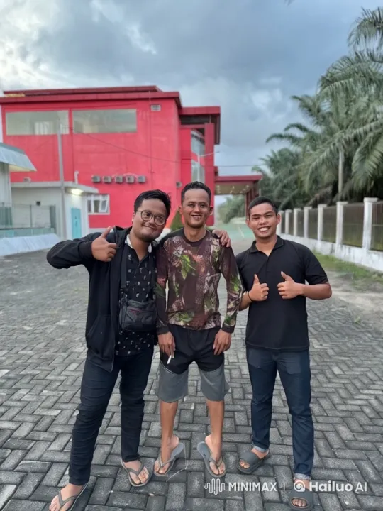 Three friends display martial arts and camaraderie in front of a red building – AI Generated Video | Hailuo AI